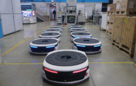 A fleet of Bosch Rexroth autonomous mobile robots (AMRs) in an warehouse.