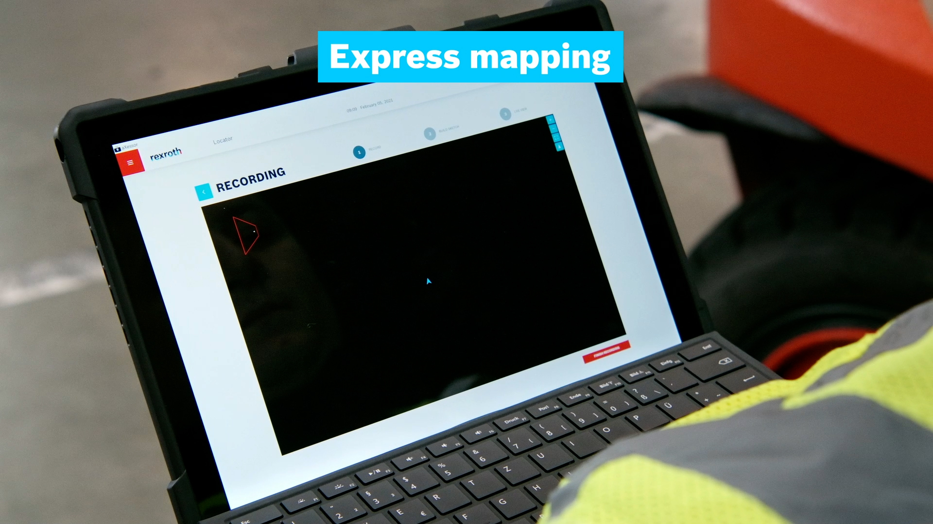 A laptop showing the Bosch Rexroth Rokit Locator software monitoring a robot and recording a map inside a warehouse.