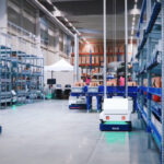 Brightpick Autopicker robots moving around autonomously in Rohlik Group's Prague warehouse.